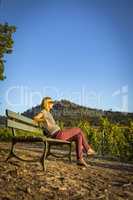Women sitting on bench in the wine region Baden-Baden Rebland