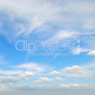 Light cirrus and cumulus clouds against the blue sky.