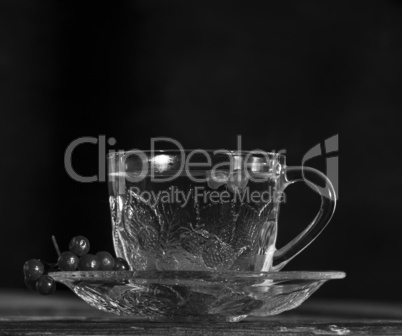 hot viburnum tea in a transparent cup with a handle