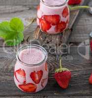 smoothies of fresh strawberries and yogurt in a glass jar