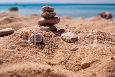 Close-up of a pyramid of stones laid on a sea beach
