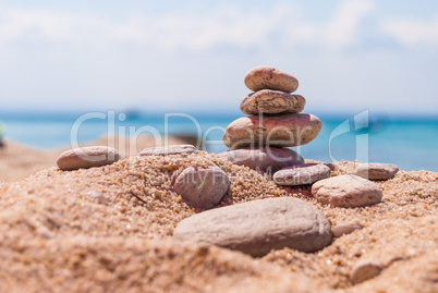 Close-up of a pyramid of stones laid on a sea beach