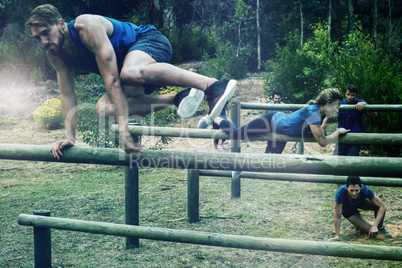 People jumping over the hurdles during obstacle course