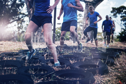 People receiving tire obstacle course training