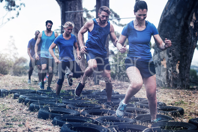 People receiving tire obstacle course training