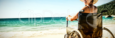 Wheelchair woman sitting smiling at camera