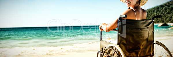 Wheelchair woman sitting smiling at camera