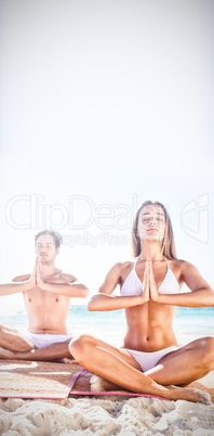 Happy couple doing yoga