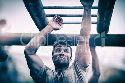 Soldier climbing monkey bars