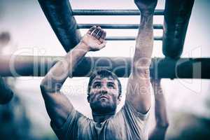 Soldier climbing monkey bars