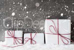 White Gifts With Red Ribbon, Grungy Cement Background, Snowflakes