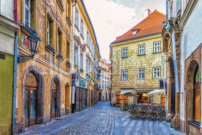 Prague Street in Old town and a street restaurant, no people