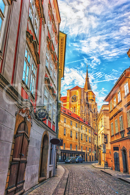 The Church of Saint Giles in a narrow street of Prague, no peopl