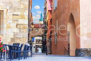 Street cafe in Old Town Square in front of the House at the ston