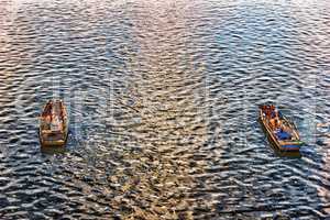 Fishermen in the boats in the river Vltava