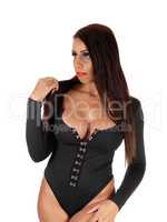 Pretty woman standing in a black body suit