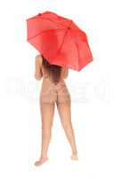 Nude woman standing with a red umbrella from back