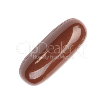 one brown gelatine pill isolated on white backgroung