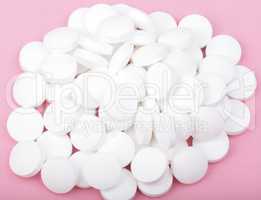 white pill on pink background