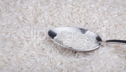 rice food background and teaspoon