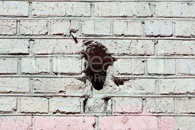 red brick wall background  with black hole