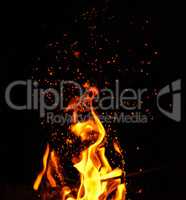 bright orange and yellow flames with sparks,