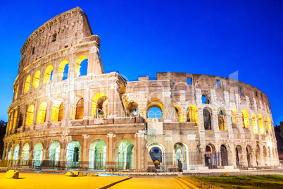 Coliseum in the evening in the lights under the starlit sky, Rom