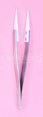 Steel Ceramic Tweezer  on pink background