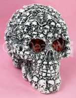 skull head toy on pink background