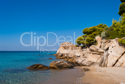 Sunny beautiful summer sea view with Greek blue sea and shallow