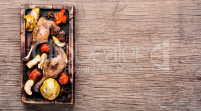 Duck legs with vegetable garnish