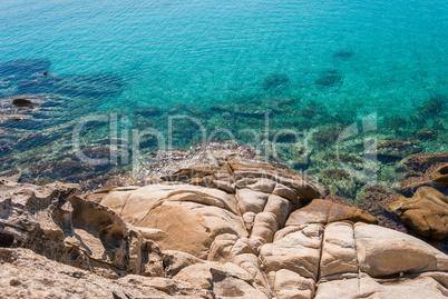 Sunny beautiful summer sea view with Greek blue sea and shallow