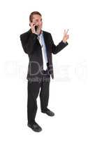 Man standing talking on phone with victory sign