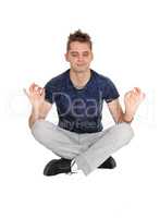 Young man sitting on floor in a yoga pose