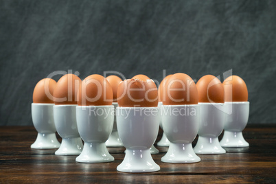 Boiled Eggs in Egg Cups on a Table