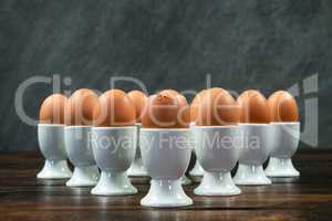 Boiled Eggs in Egg Cups on a Table
