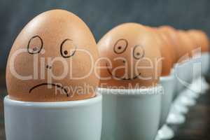 Happy Sad Emotional Concept Eggs in Egg Cups