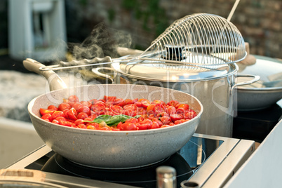 Cherry tomatoes on a saucepan