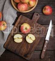 ripe red apples, chopping wooden board