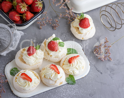 small baked round cake meringue with whipped cream