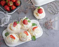 small baked round cake meringue with whipped cream