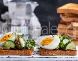 square pieces of bread from white wheat flour with boiled egg