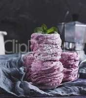 stack of big pink marshmallows on a gray napkin