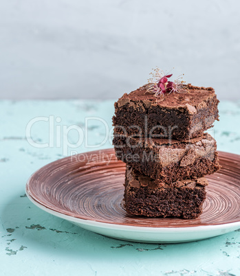 stack of square pieces of baked brownies