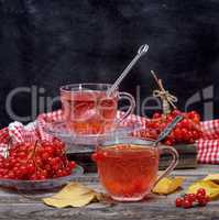 viburnum tea in a transparent cup and saucer