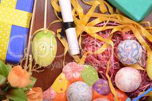Handcrafted easter eggs close up, ribbons and decoration