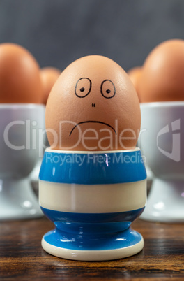 Sad Emotion Individual Concept Boiled Eggs in Egg Cups