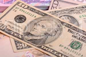 US Dollars background with focus on Alexander Hamilton