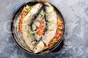 Baked fish in a pan