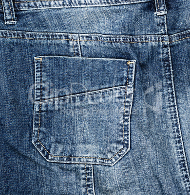 fragment of blue textile jeans with a back pocket